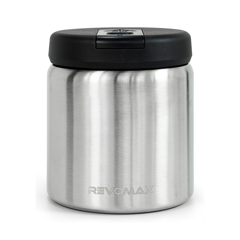 Stainless steel food container with black lid on a white background, featuring the Revomax brand.